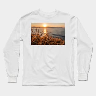 Sunrise from behind the grass on the mountain at umina on nsw central coast Long Sleeve T-Shirt